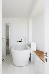Nick got his wish of being able to watch the surf from the bathtub with the insertion of a sliver window in the master bath.

Pett Level, England
Dwell Magazine : November / December 2017