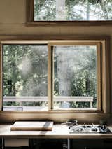 Large windows brighten the space, which looks out over a large deck.