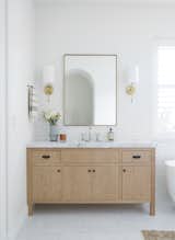 "The materials and finishes used in the main bath really transformed it from being solely utilitarian into a zen retreat," she says.