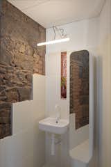 Exposed brick and bluestone in the second-level bathroom.