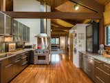 The stainless steel kitchen has been updated with modern top-of-the-line appliances. 