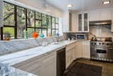 The updated kitchen features high-end appliances.