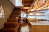 On the second level is a large open plan living, dining and kitchen to the left of the stairs.