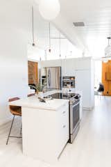 Hong elevated the new IKEA kitchen with white slab fronts from Semihandmade.