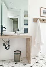 The tall black faucet was an Amazon find, and the ceramic vessel sink from Wayfair.