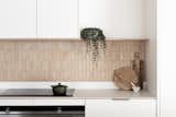 “The terra-cotta backsplash in the kitchen is probably most people’s favorite feature. It was such a simple way to tie all the colors together in the house,” adds Rebecca.